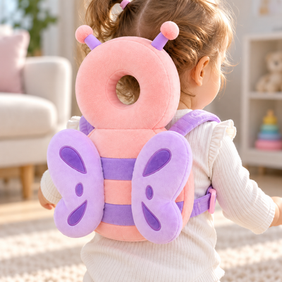 Close-up back view of the Anti-Fall Pillow showing the pink donut head cushion and plush butterfly wing straps