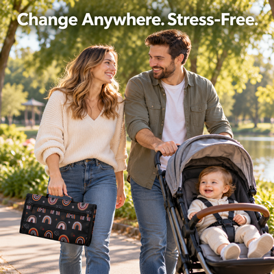 Change Anywhere. Stress-Free. Parents walking in a park with a stroller and the folded changing pad