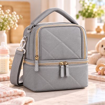 Gray Milk Cooler Bag product photo on a softly lit neutral nursery-inspired countertop