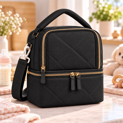Black Milk Cooler Bag product photo on a softly lit neutral nursery-inspired countertop